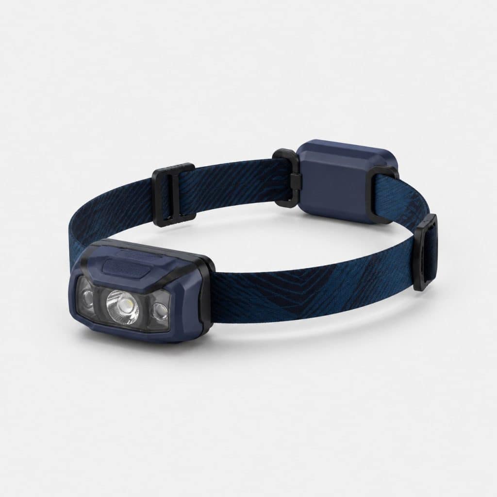 Lampe frontale eclairage reactif trail, vue de face sur fond clair